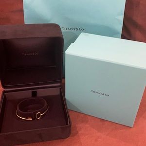 Tiffany and Co. yellow gold key bangle size medium.